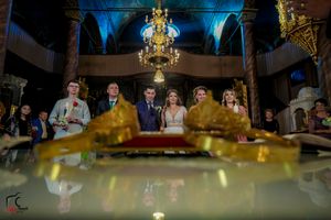 Romantic reception venue with stunning chandeliers and ambient blue lighting creating an intimate atmosphere.
