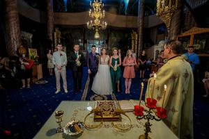 Luxurious wedding venue featuring crystal chandeliers and dramatic architectural details.