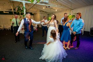 Guests enjoy a lively dance circle moment during the wedding celebration.