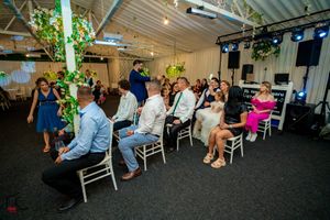 Indoor celebration space with modern lighting and natural decor elements.