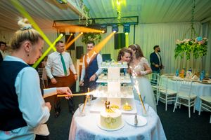 Wedding venue with greenery accents and ambient lighting creating a romantic atmosphere.