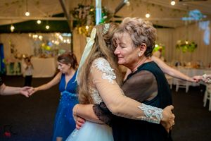 Wedding reception dance floor filled with guests enjoying the celebration.