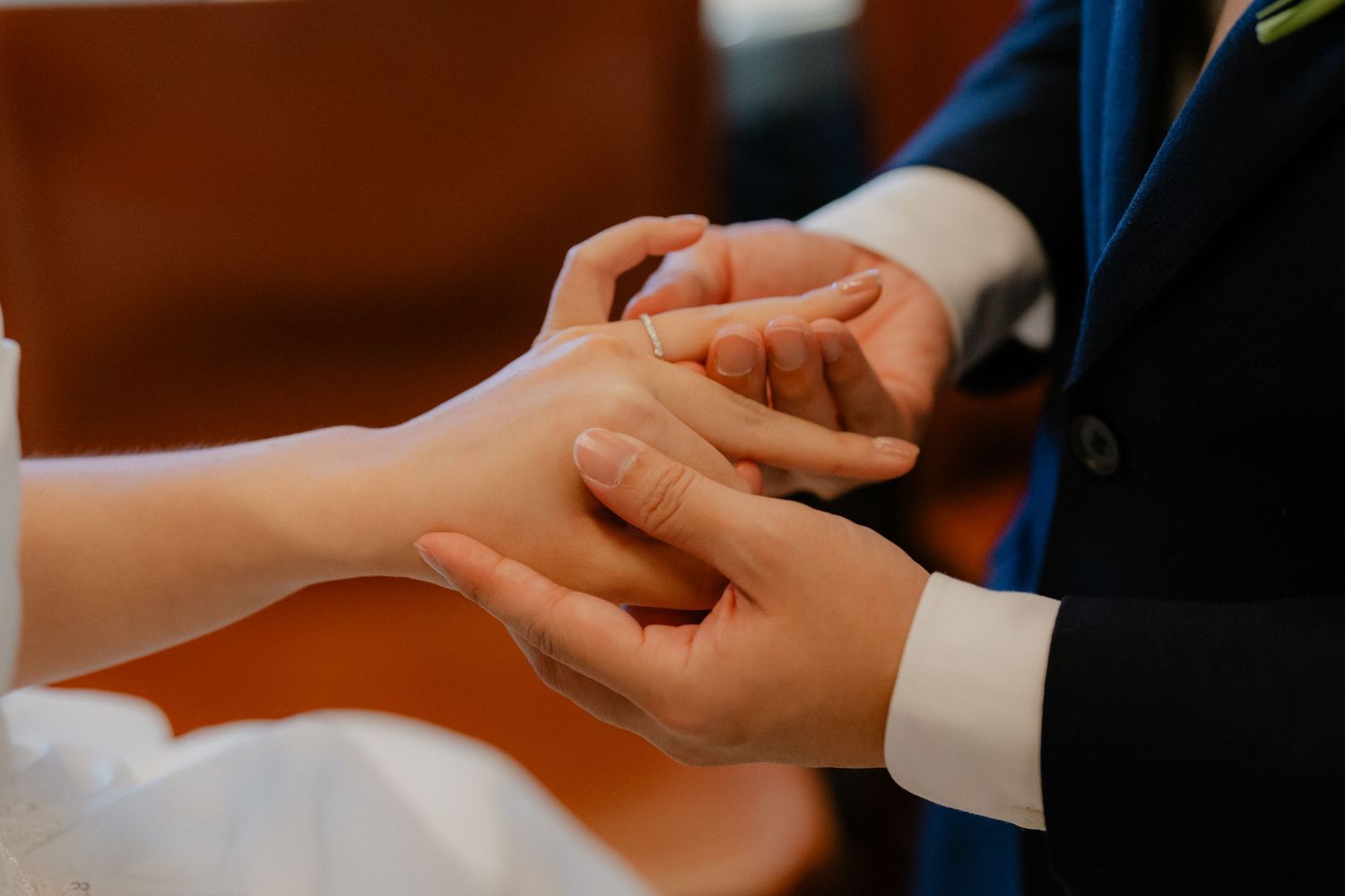 Business people shaking hands during meeting, symbolizing partnership and agreement at a wooden table.