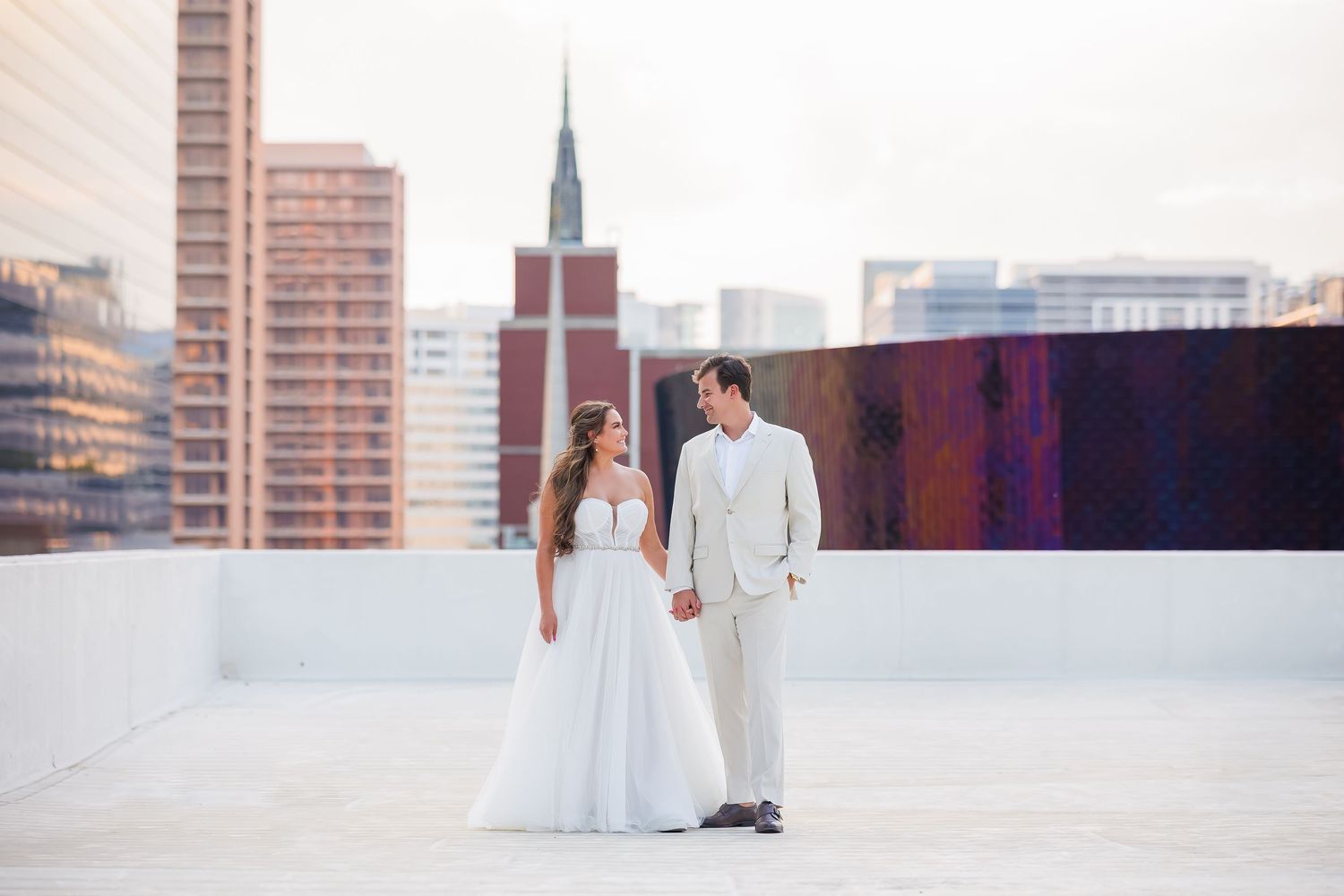 Couple poses on the rooftop at The Venue at 400 North Ervay, a Dallas wedding venue