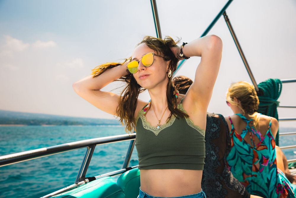 Summer sailing adventure with ocean views and bright sky in background.