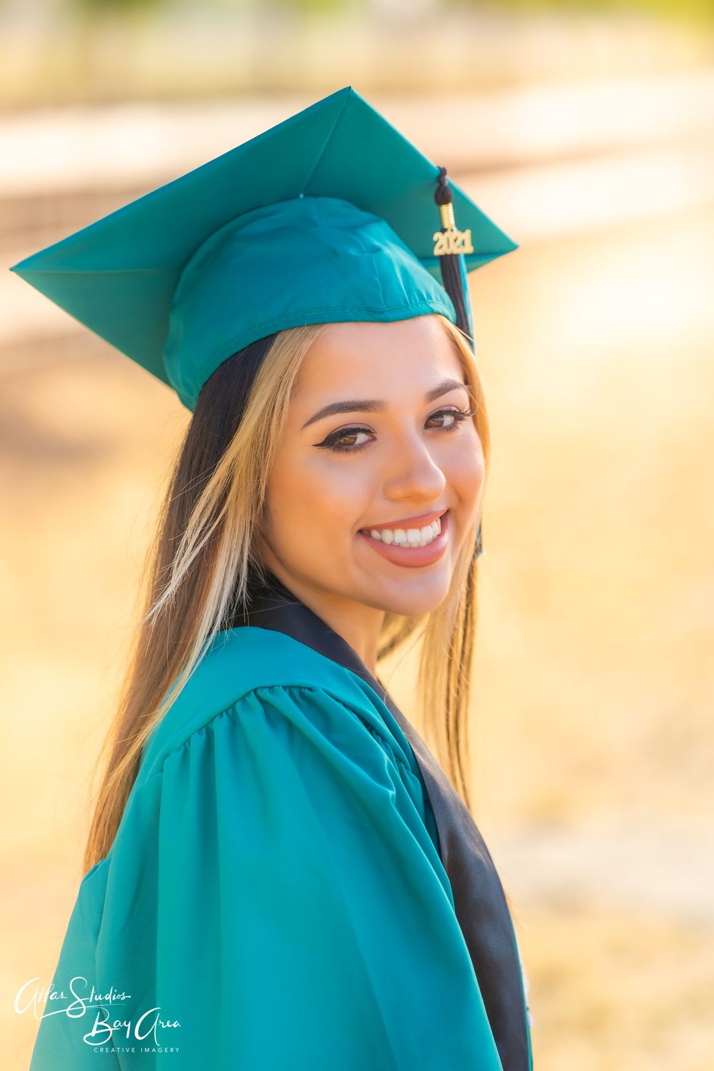 Series of graduation portraits showing graduate in teal cap and gown smiling.