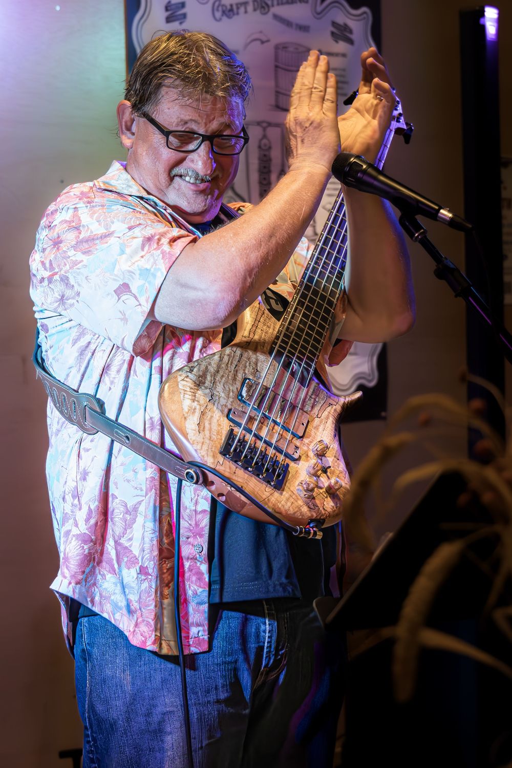 Man playing guitar and clapping