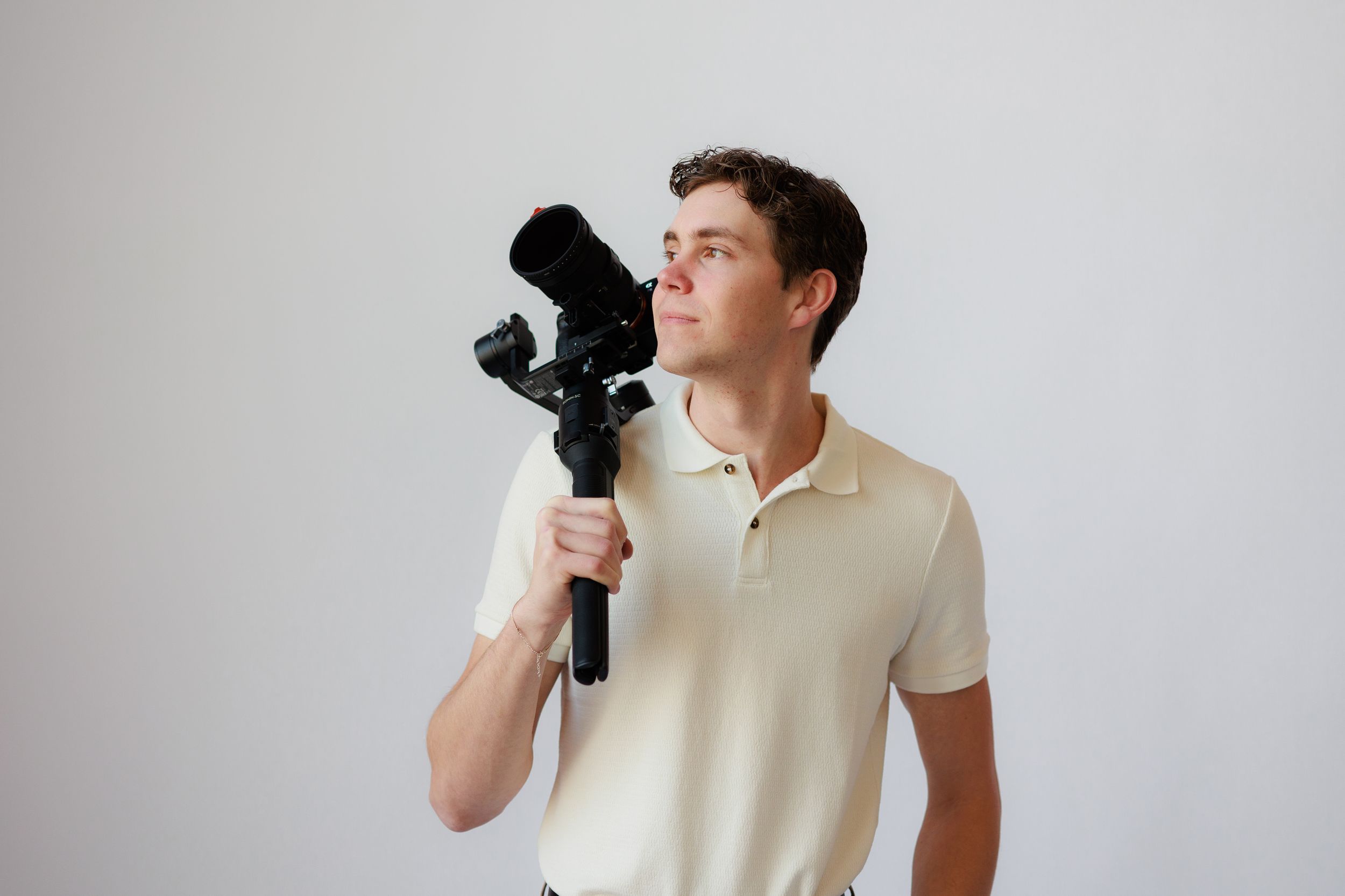 Person in cream colored t-shirt shown from multiple angles against a white background.