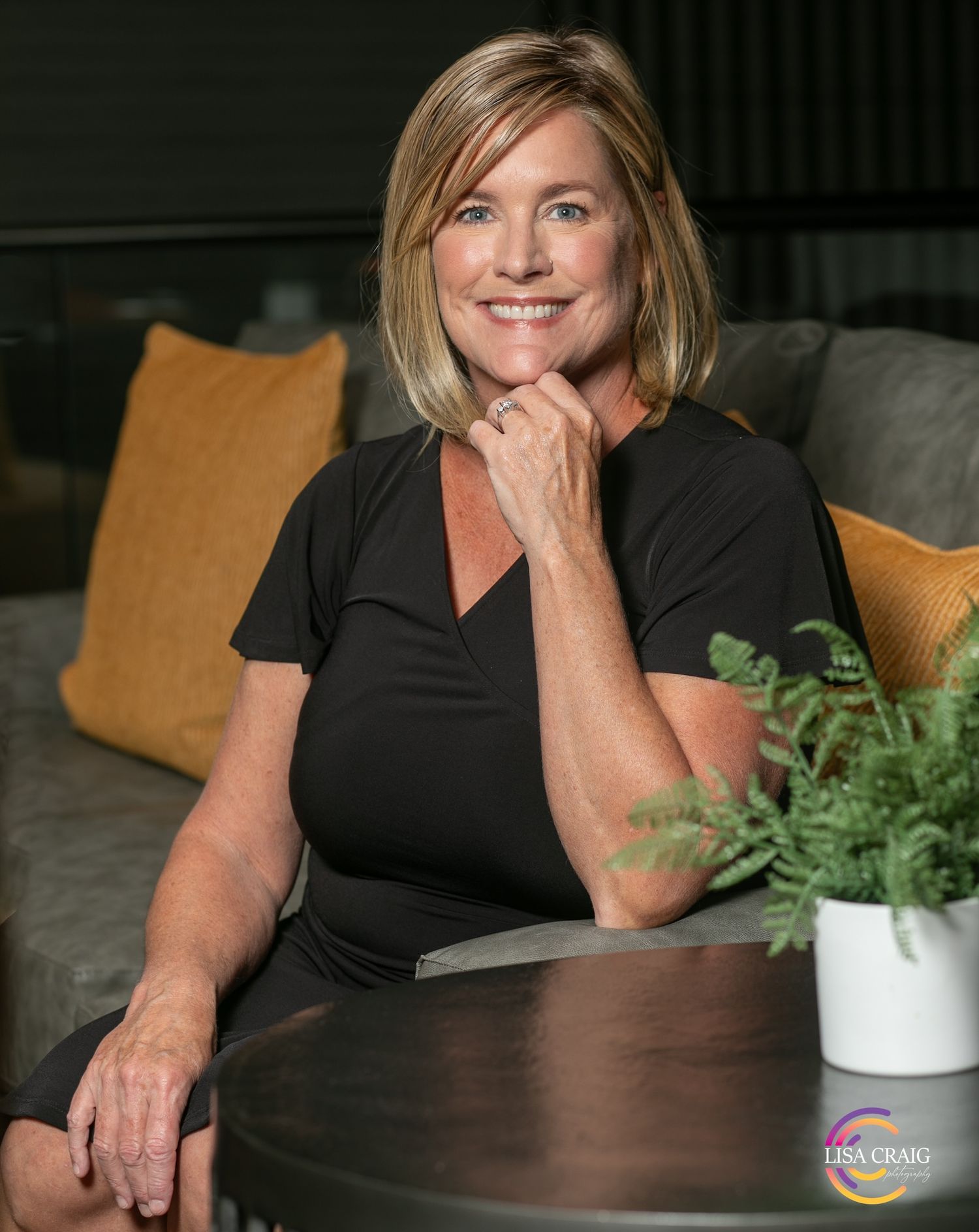 Professional headshot of a Denver business owner with a relaxed, confident expression, reflecting authenticity, trust, and a guided Headshot