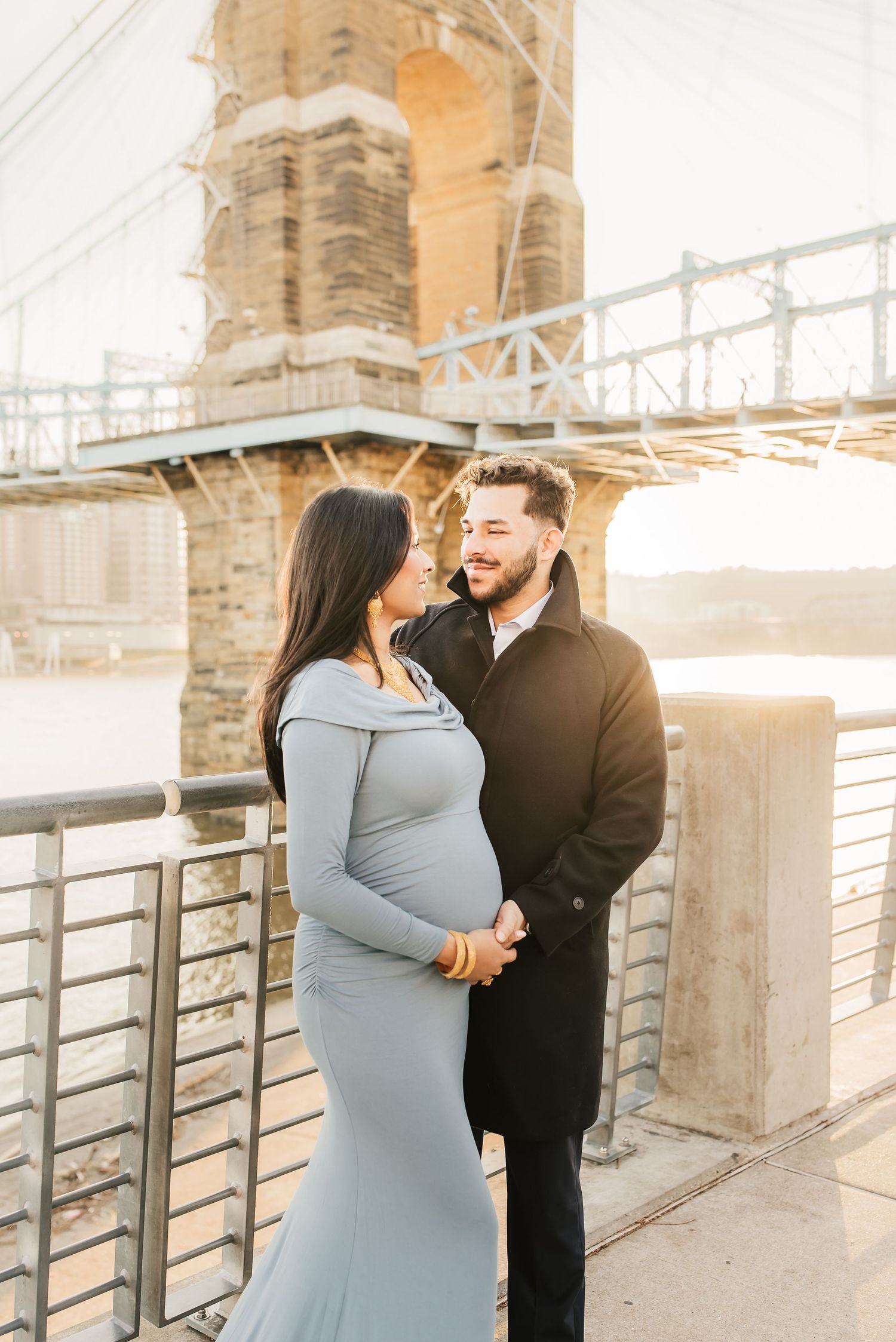 Maternity photo session in downtown Cincinnati with historic brick buildings and winter light