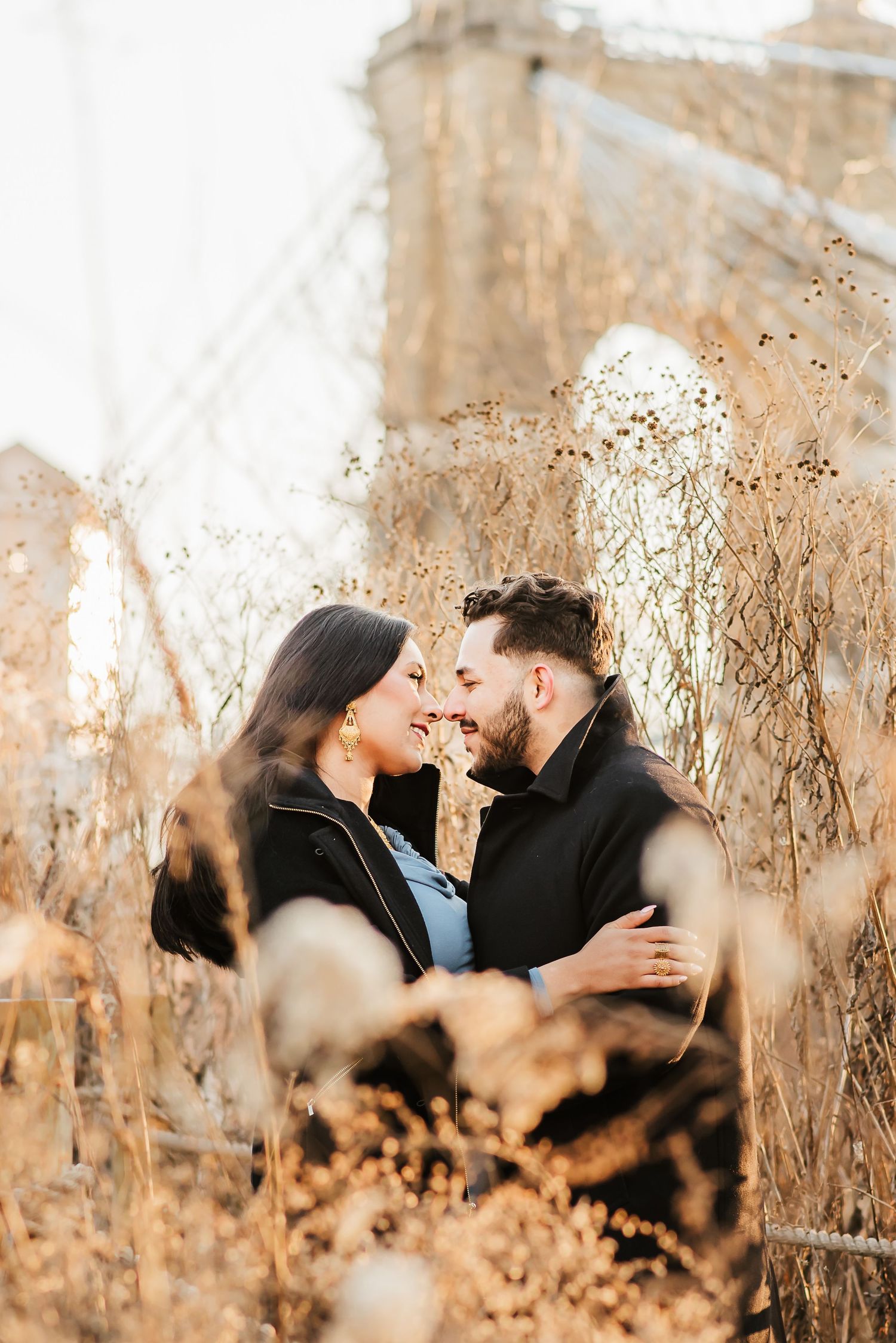 Maternity photo session in downtown Cincinnati with historic brick buildings and winter light