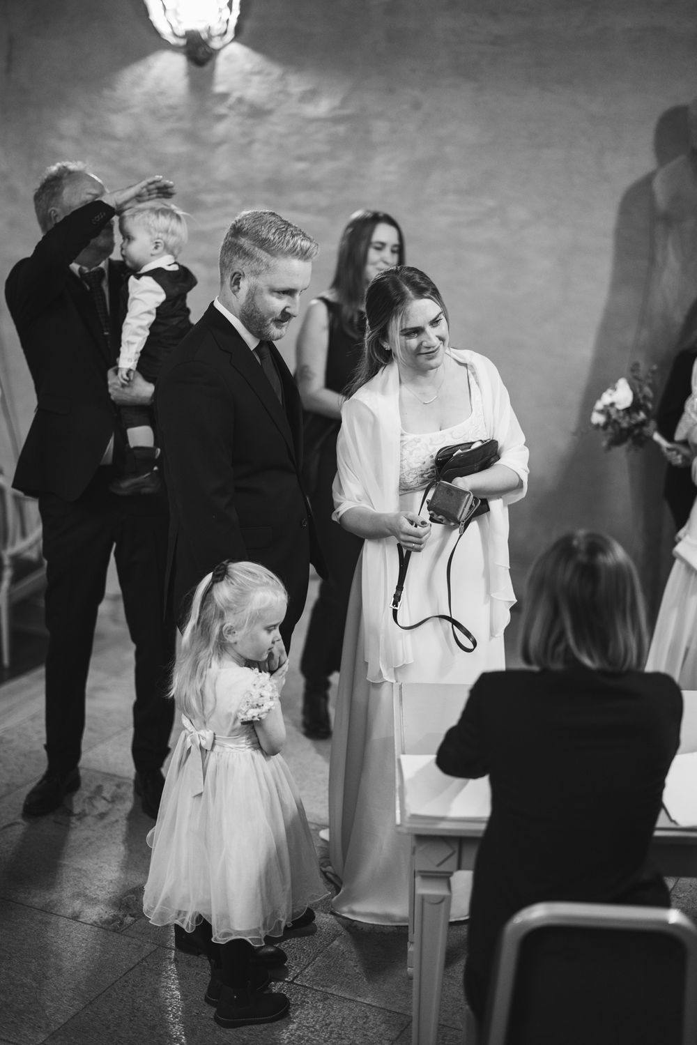 A series of black and white wedding photos showing a couple dancing together at their reception celebration.