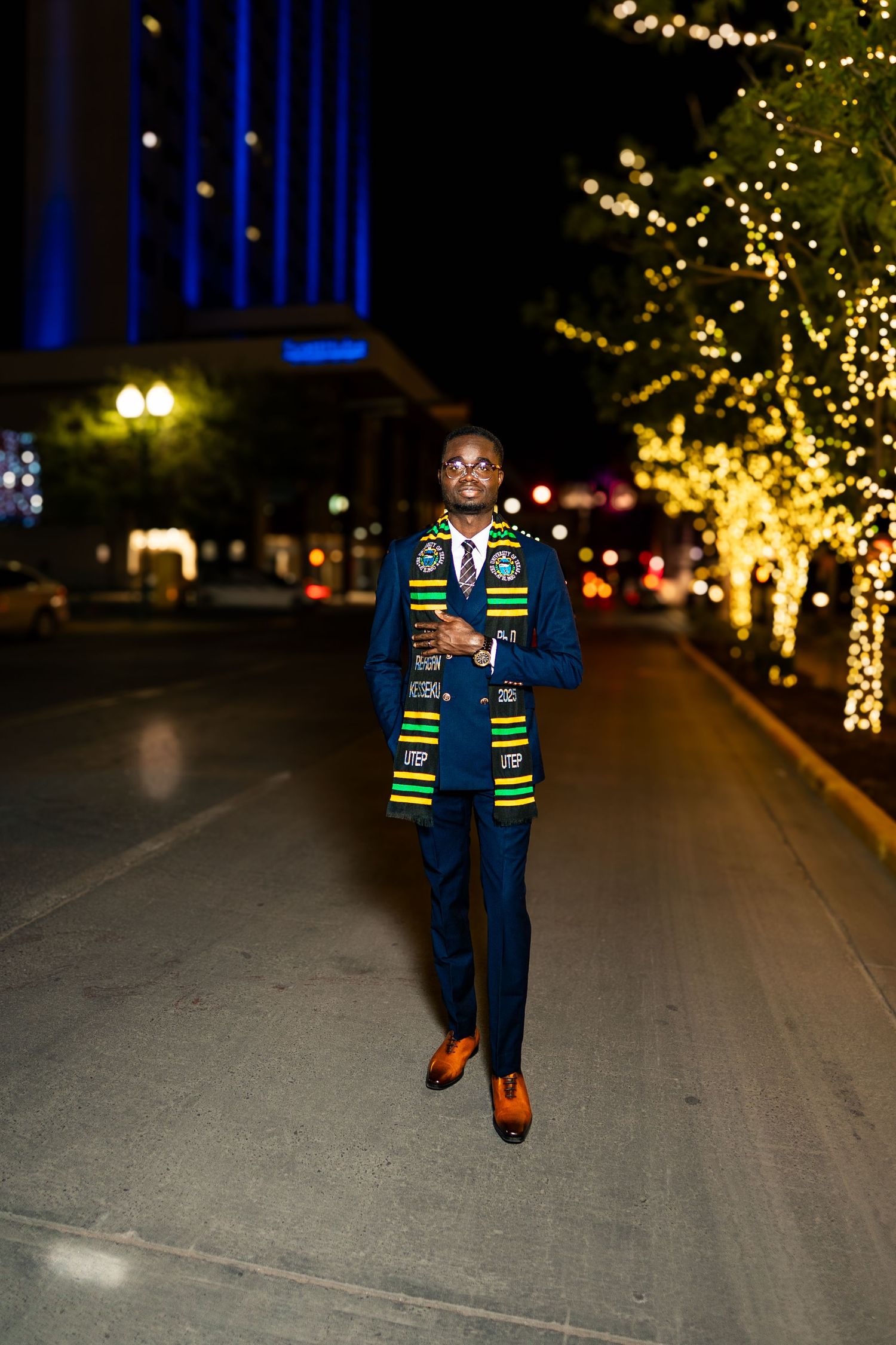 A sequence of photos shows someone walking at night along a path illuminated by twinkling holiday lights in trees.