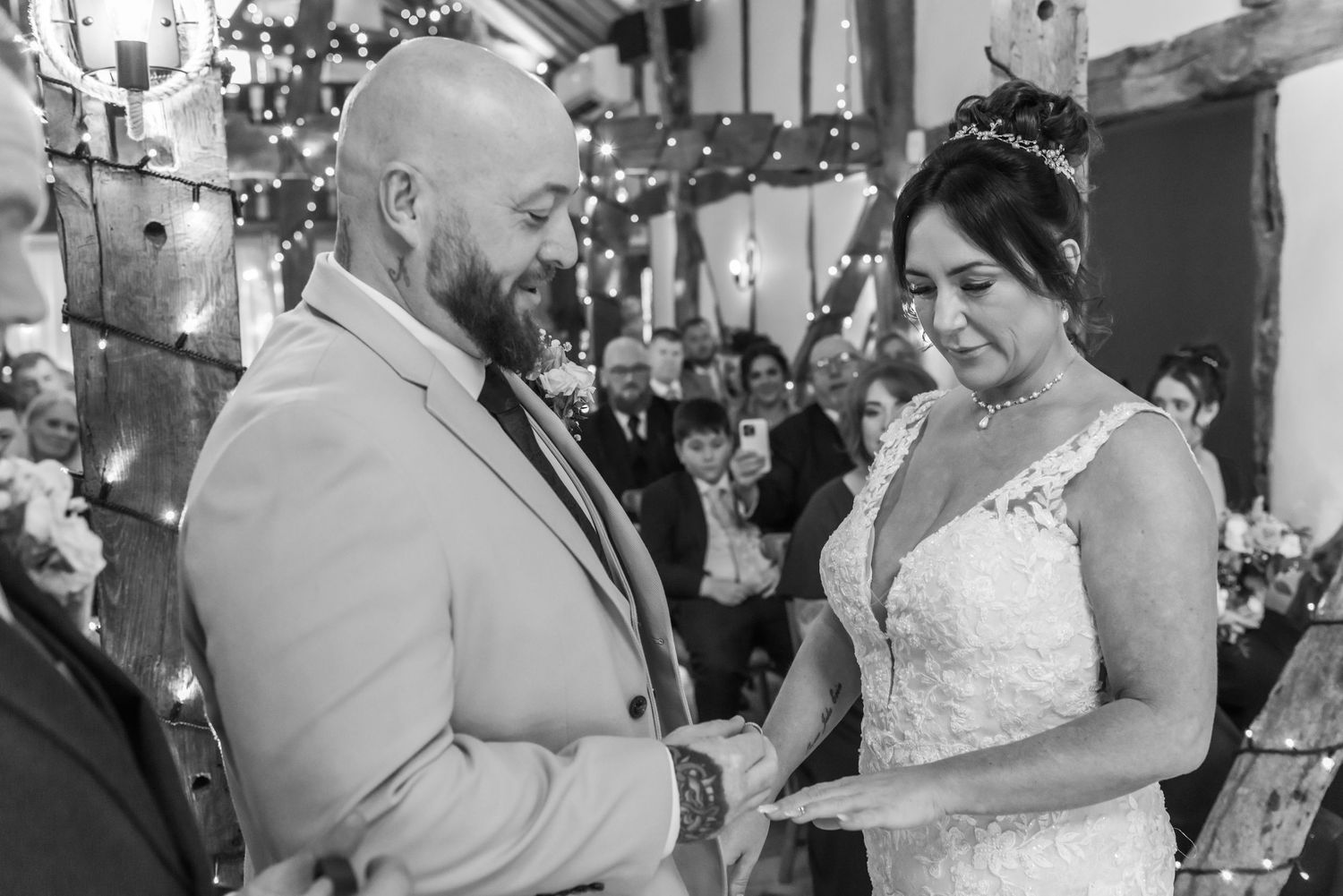 Traditional black and white bridal portrait in the ceremony barn at The Plough Inn, Eaton; artistic wedding photography by Michael Pardoe
