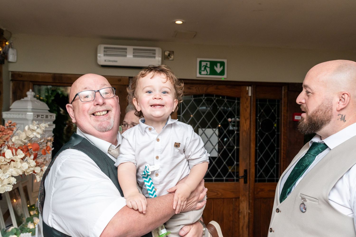 Reception celebration moments captured in candid style with joyful dancing and laughter.