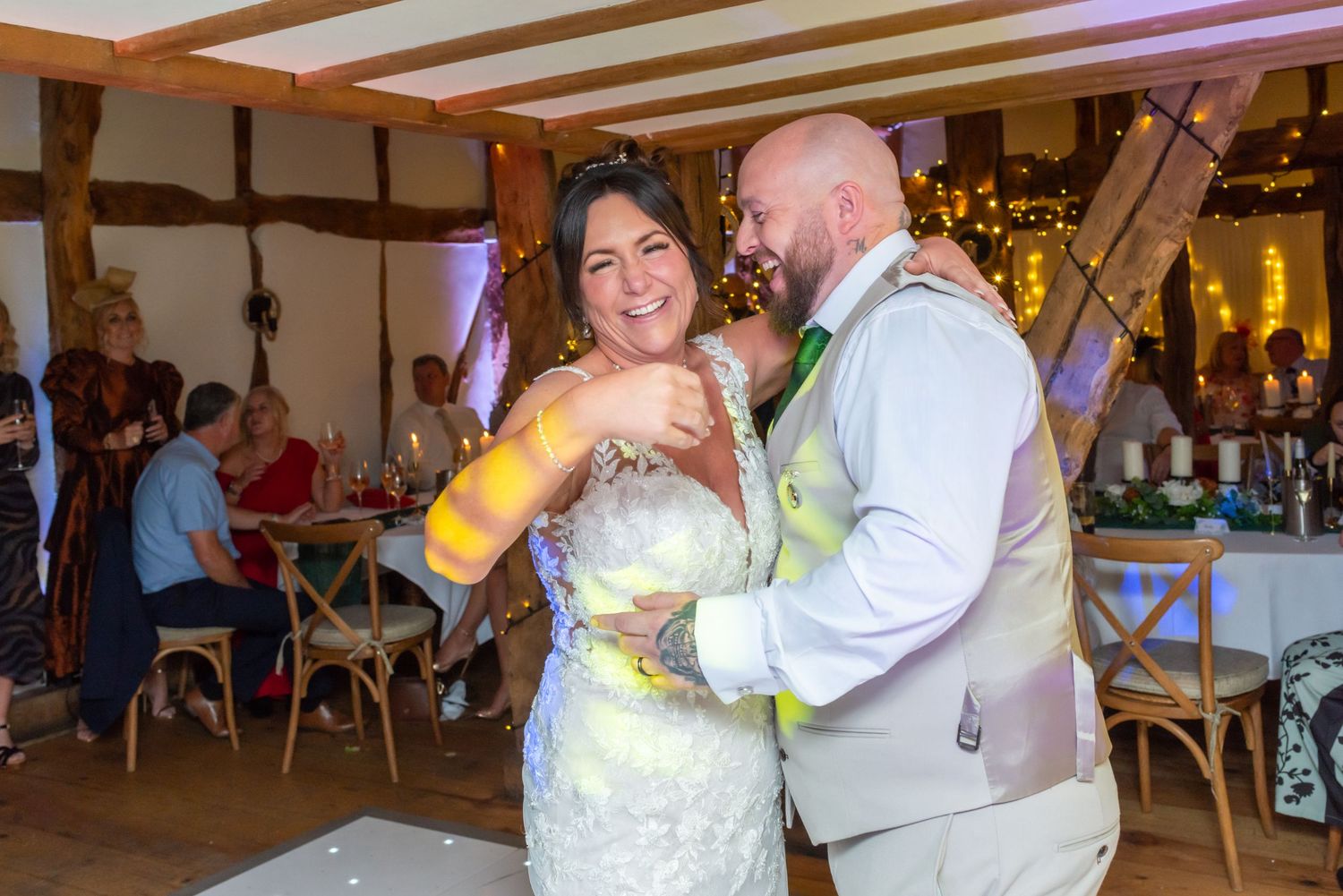 Wedding reception dance floor filled with guests enjoying the celebration.