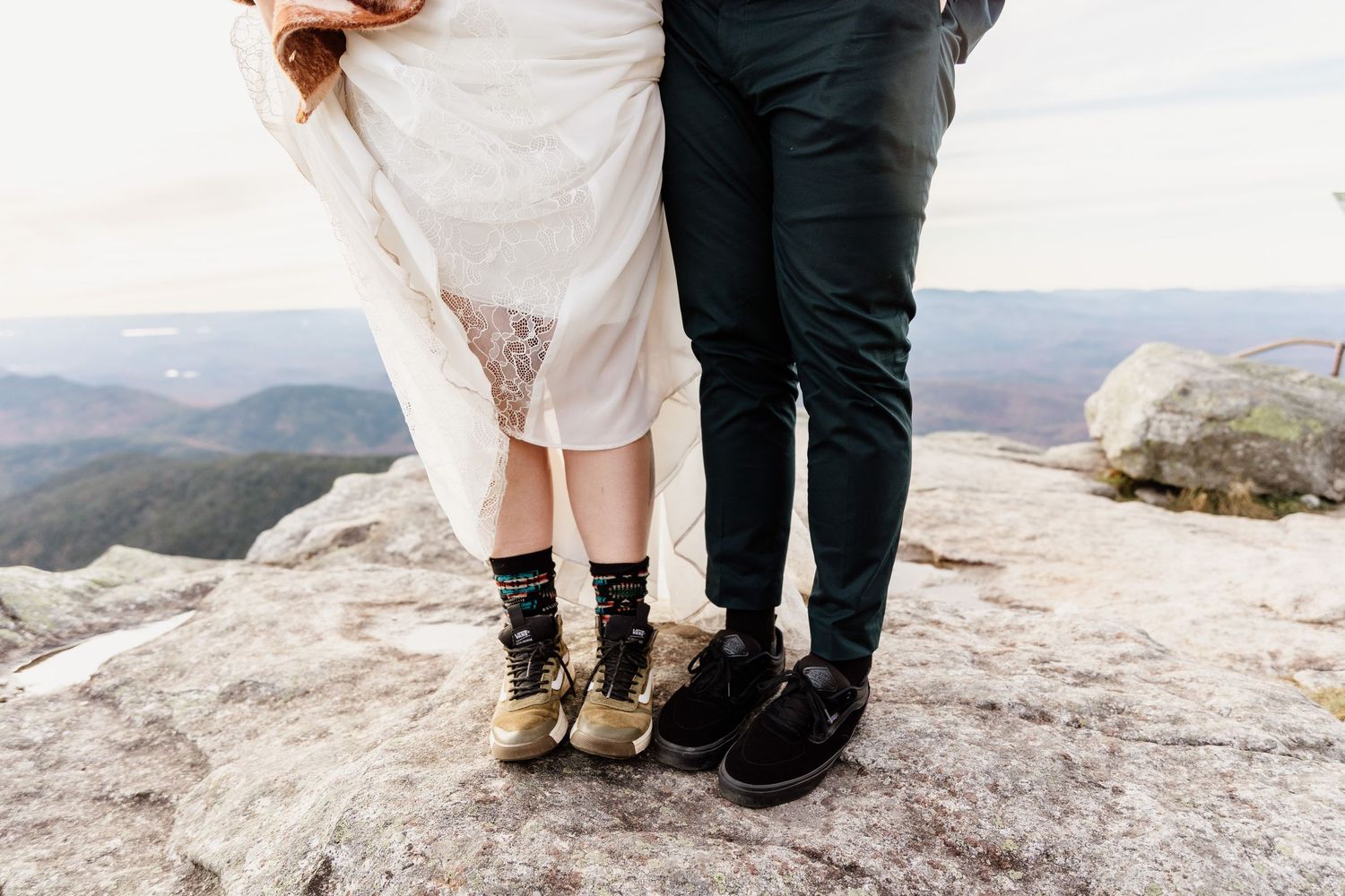 Couple eloping in the adirondacks on whiteface mountain with boots on