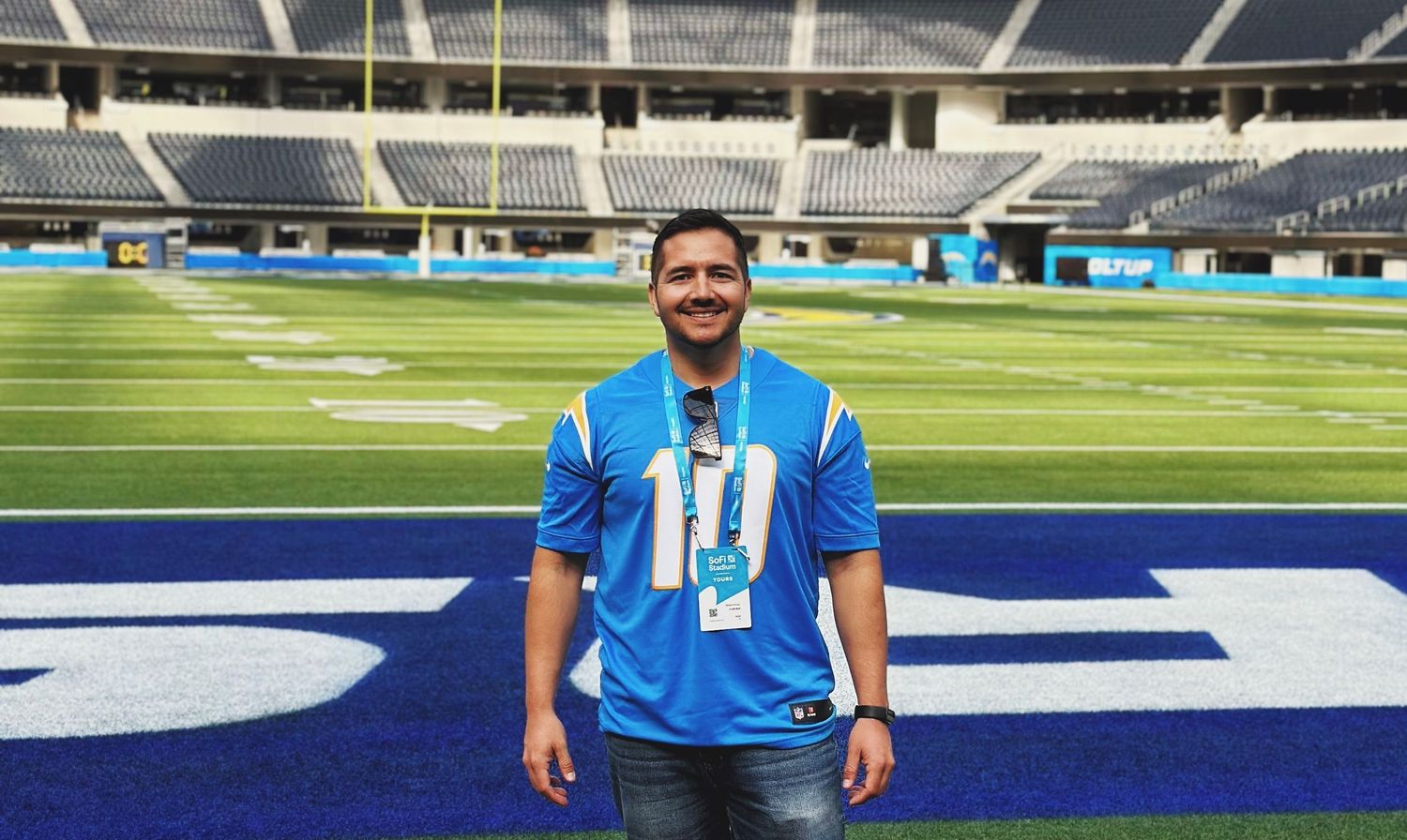 Photo of Robert Arroyo on the field at Sofi Stadium during a tour.