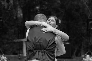 A sequence of black and white photos showing two people hugging and embracing in an emotional moment.