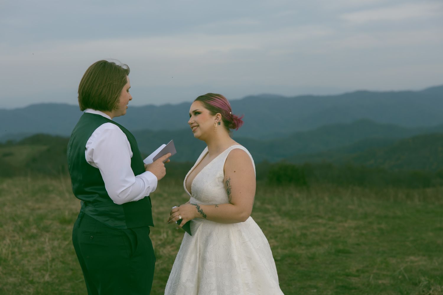lesbian wedding couple in blue ridge mountains exchanging vows