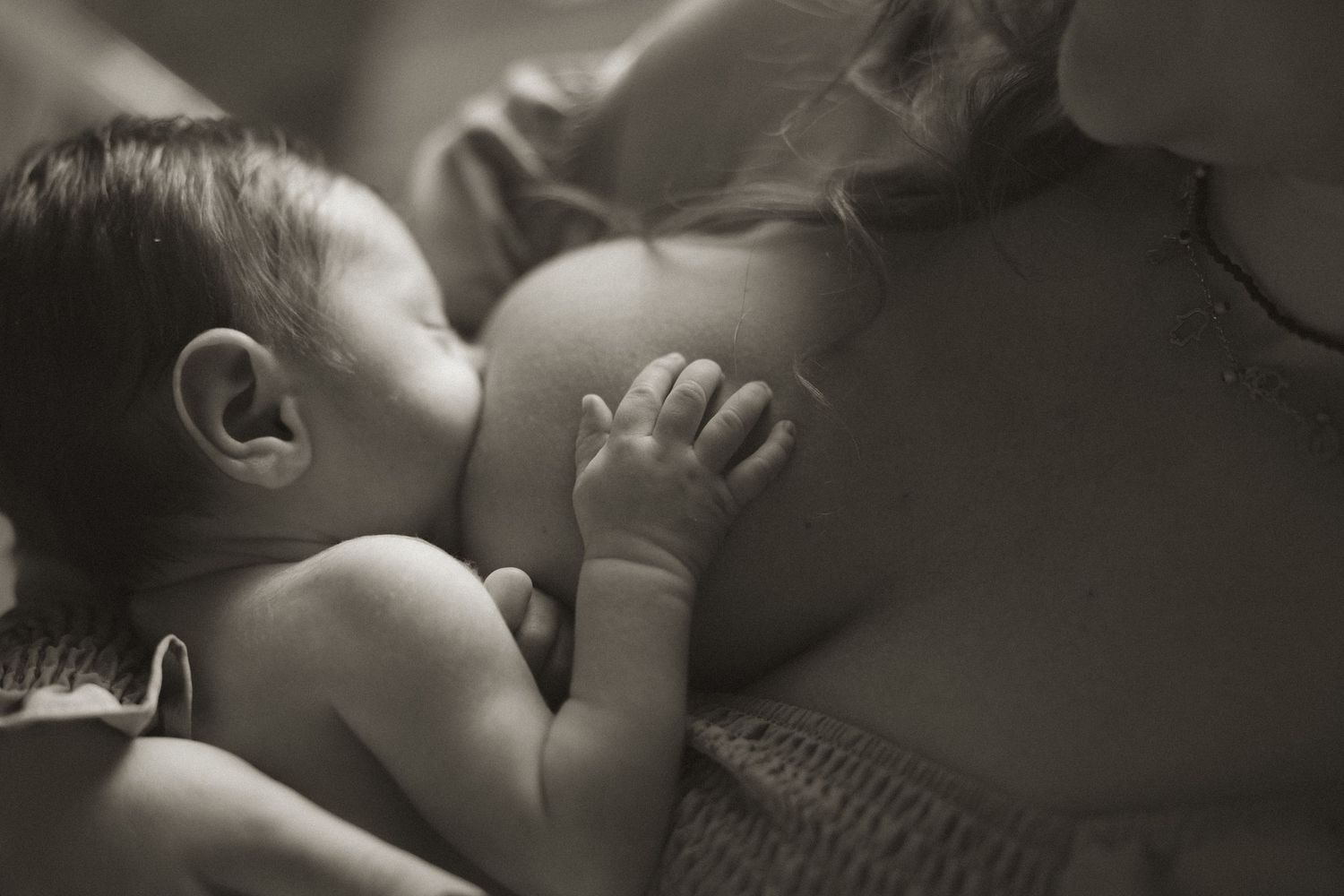A collection of black and white intimate photos showing tender moments between a couple in romantic poses.