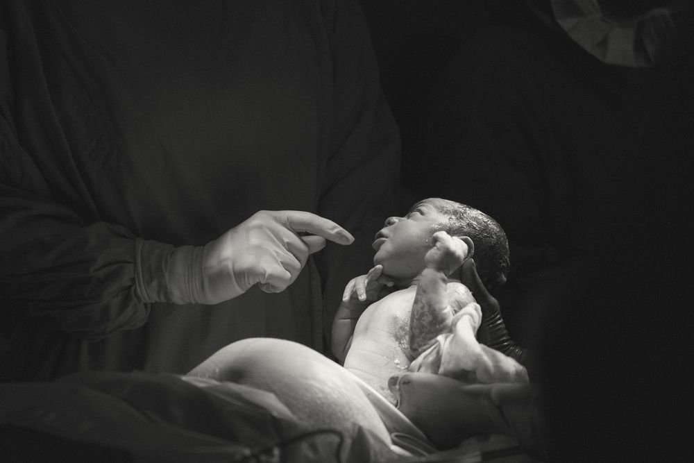 Black and white artistic photo series showing intimate dance movements and poses in dramatic lighting.