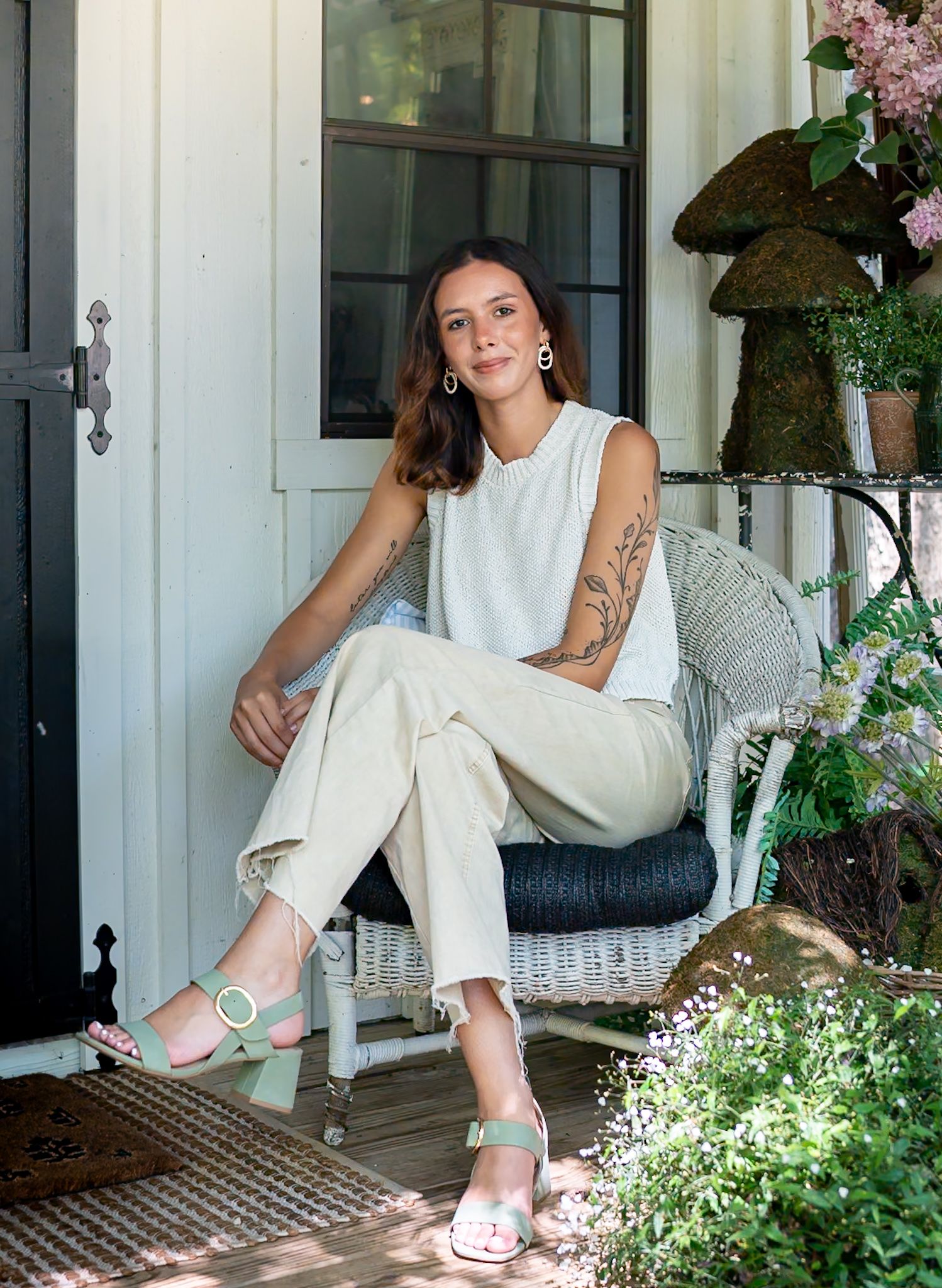 A series of casual poses on a white porch with flowers and greenery in the background.