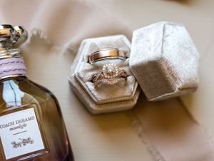 Delicate white tea bags with handwritten labels arranged in a rustic display.