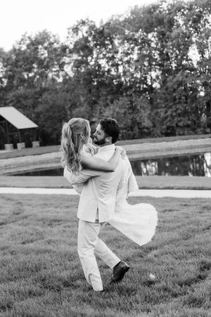Black and white photo series showing playful martial arts inspired poses on a grassy field.