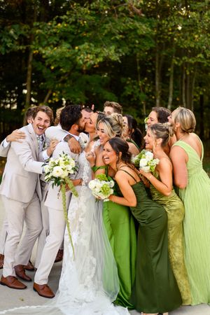 Wedding party in gray suits and green dresses pose playfully in a series of candid photos outdoors.