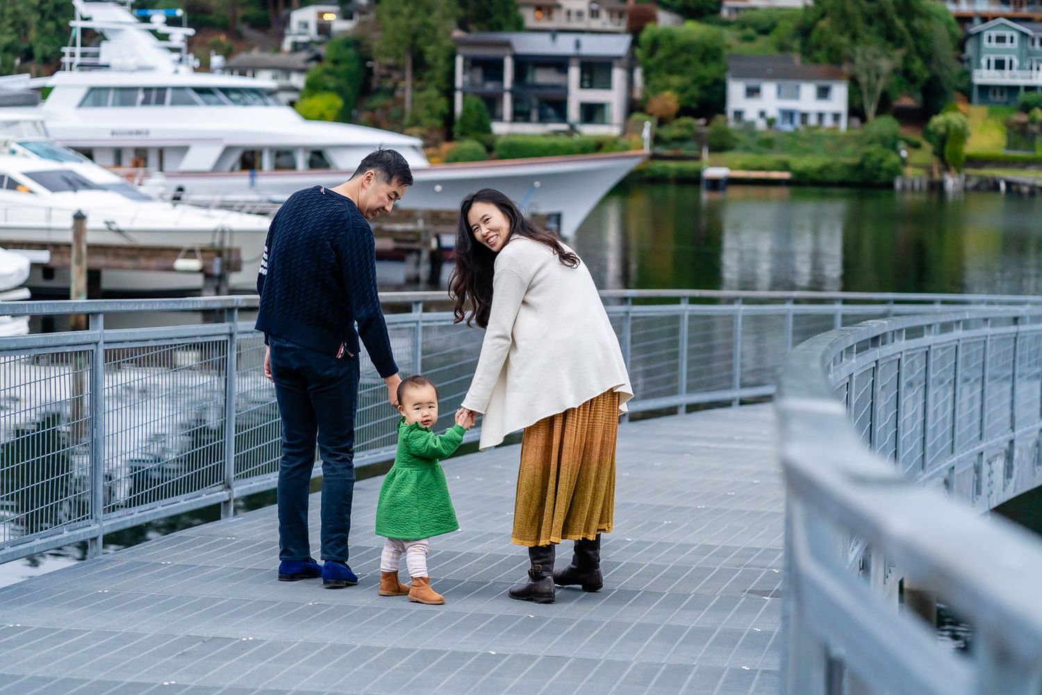 Family walking on the pedestrian pier at Meydenbauer Bay Park.