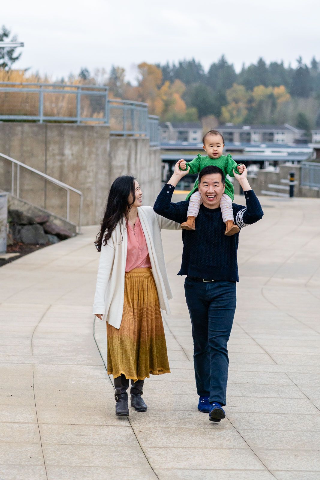 Family walking together on the paved pathway.