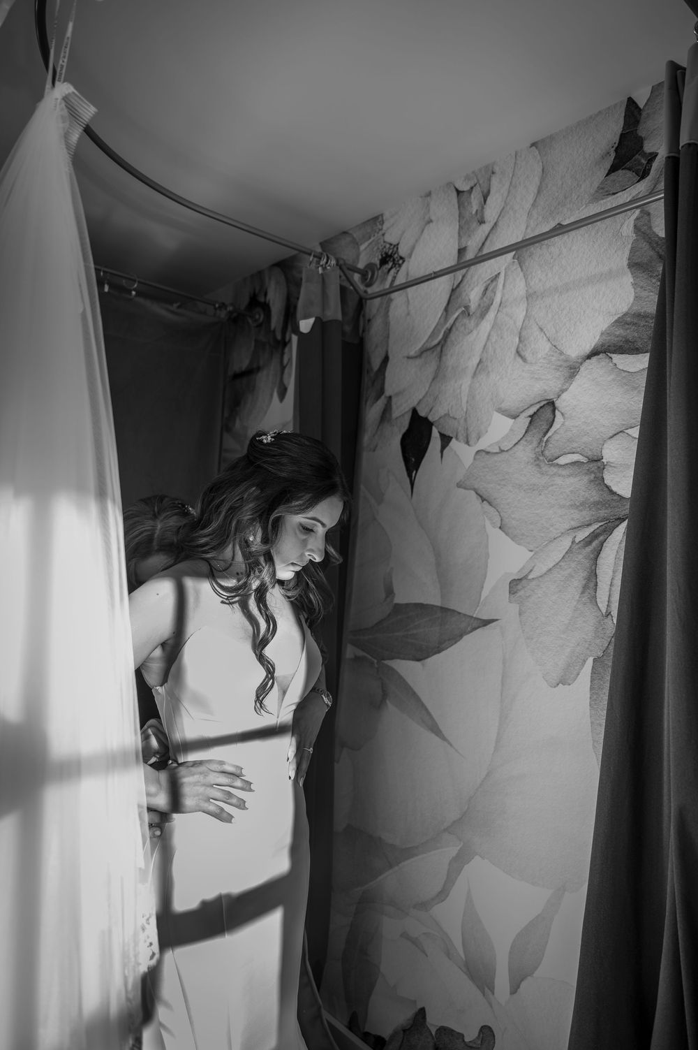 A series of black and white photos showing abstract shadows and silhouettes cast on white walls and curtains.