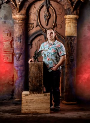 Fantasy-themed portrait with ornate stone archways and dramatic red lighting.