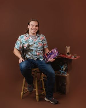 Casual studio photo with gaming collectibles and merchandise displayed on a wooden table.
