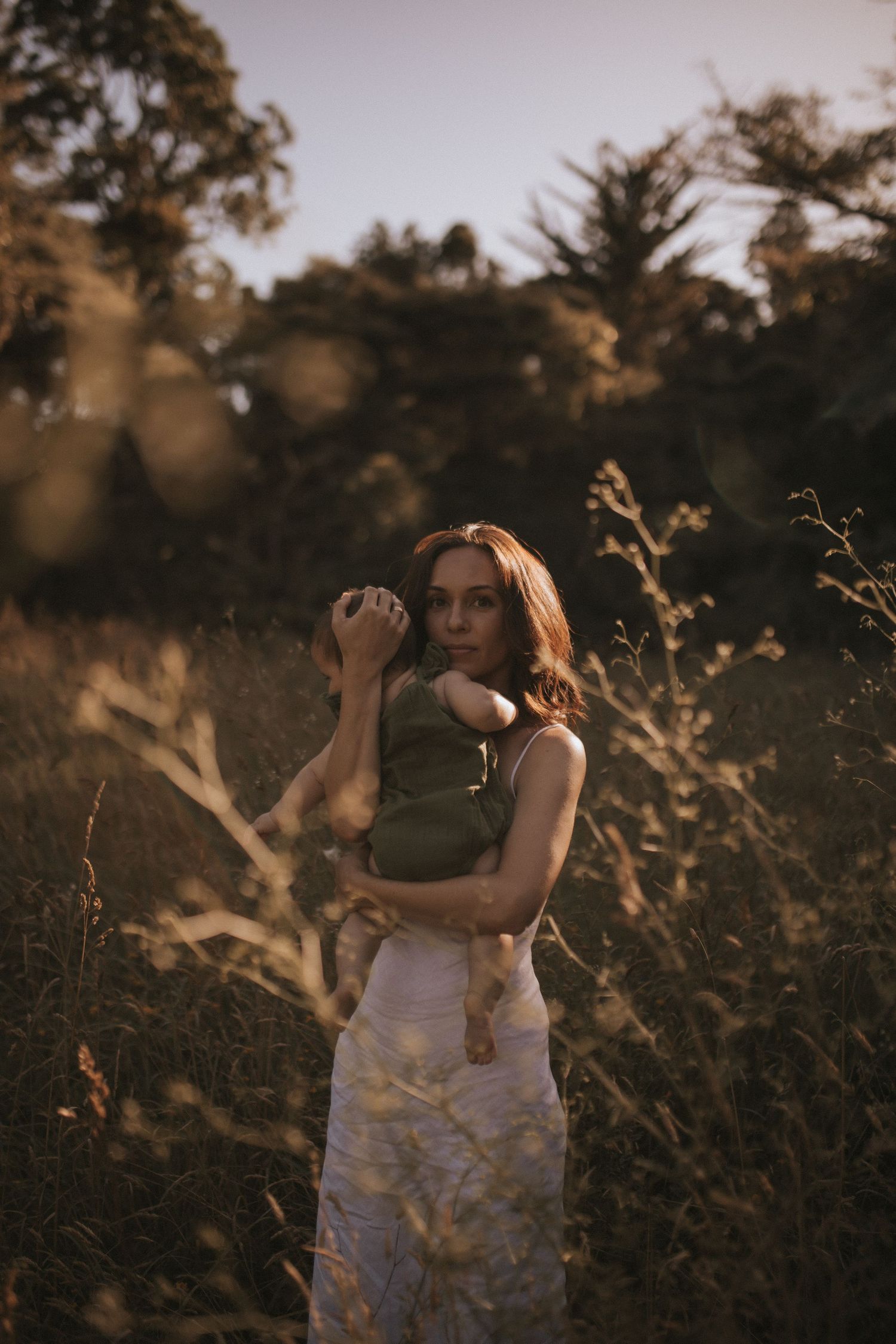 Motherhood portrait photographer in Raglan NZ offering natural, emotive photography for mothers and families in New Zealand.