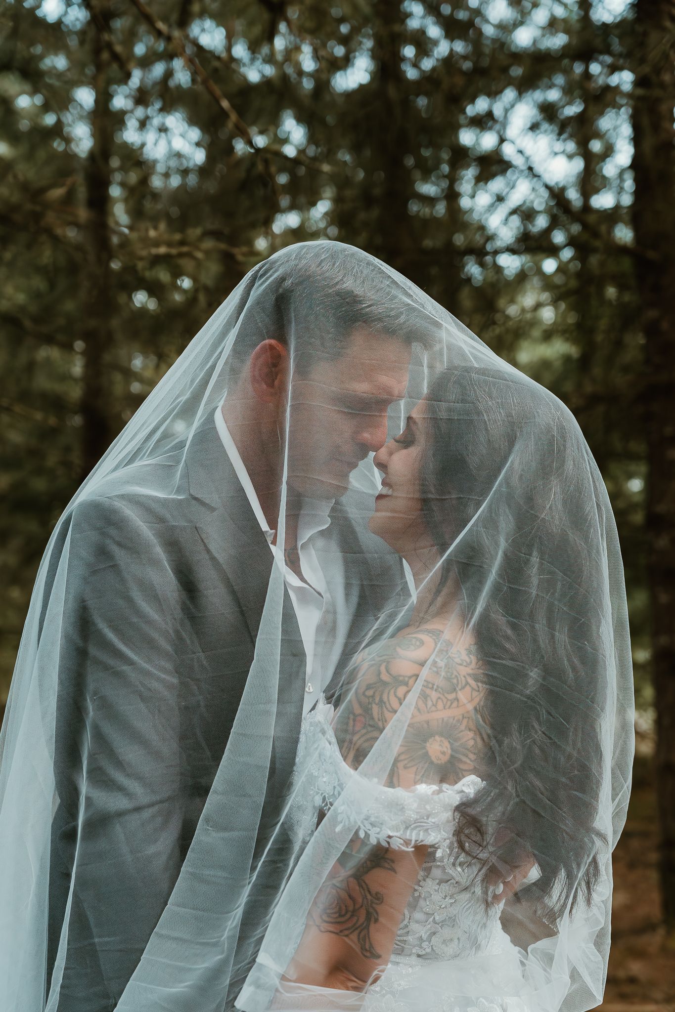 nose to nose embrace under the veil.