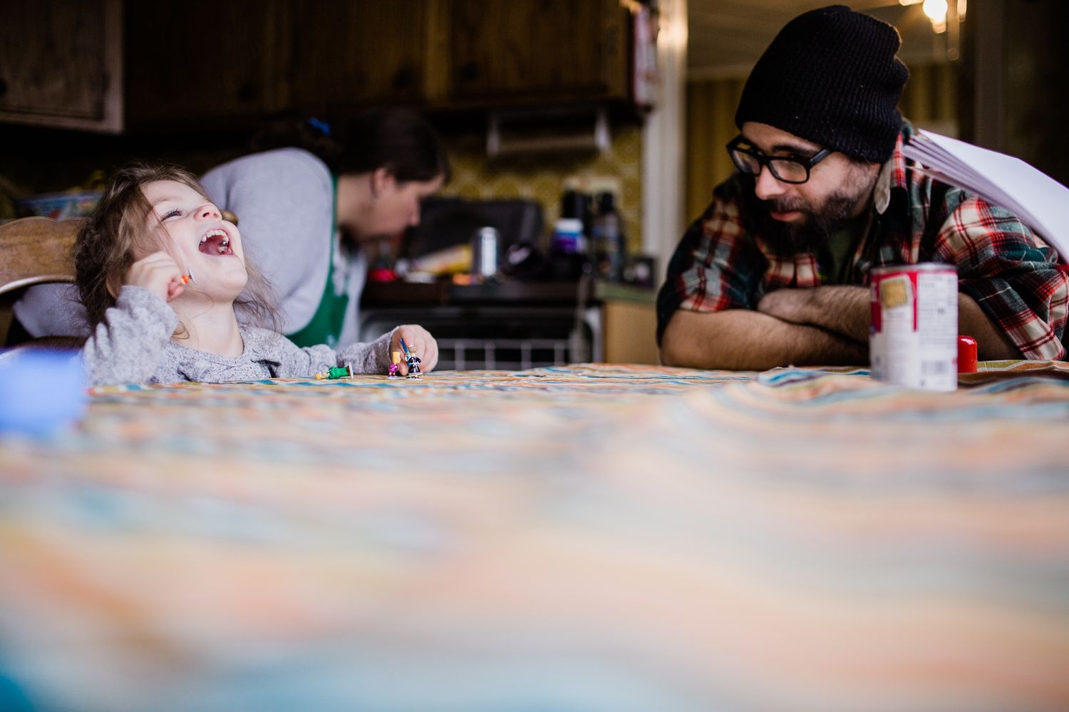 A playful moment captured during mealtime at a restaurant table.