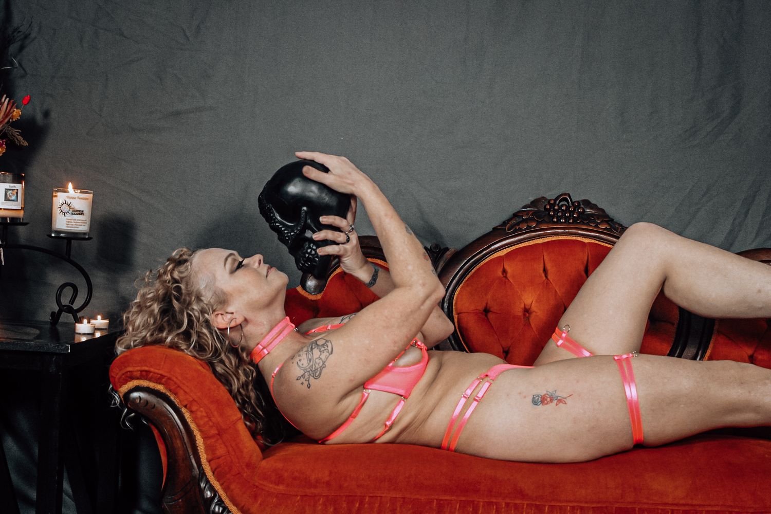 Artistic boudoir photo sequence on a red chaise lounge with dramatic lighting and shadows.