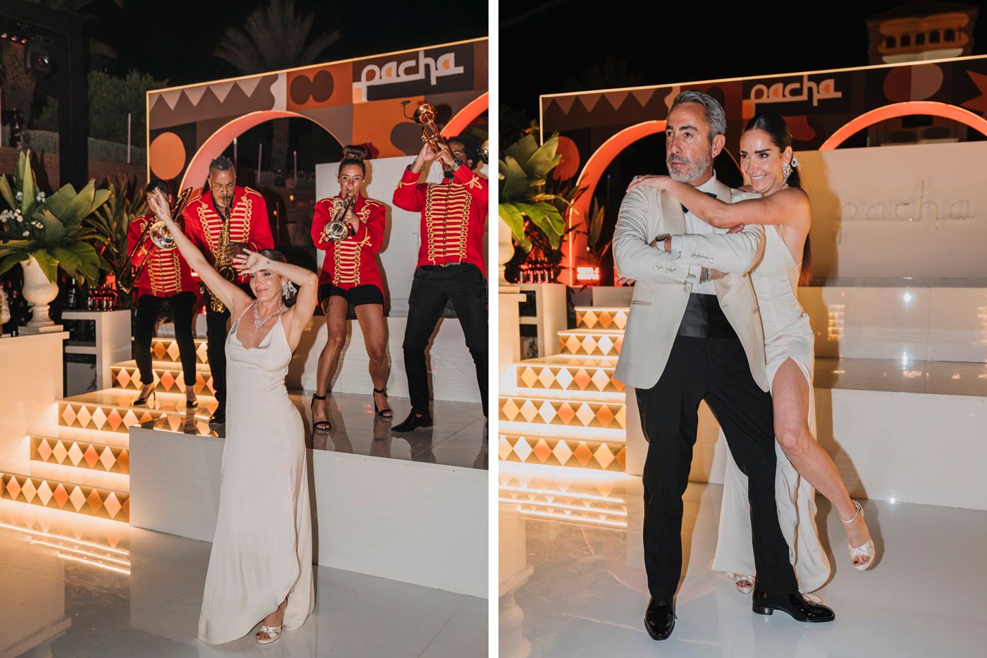 Wedding reception dancers perform joyful moves on elegant white steps decorated with glowing candles and warm lighting.
