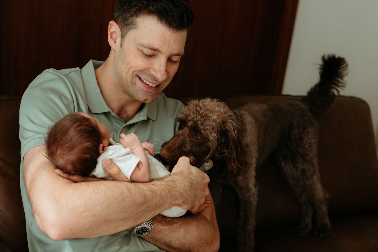 Newborn photoshoot at home lifestyle relaxed real and raw in abu dhabi with pets
