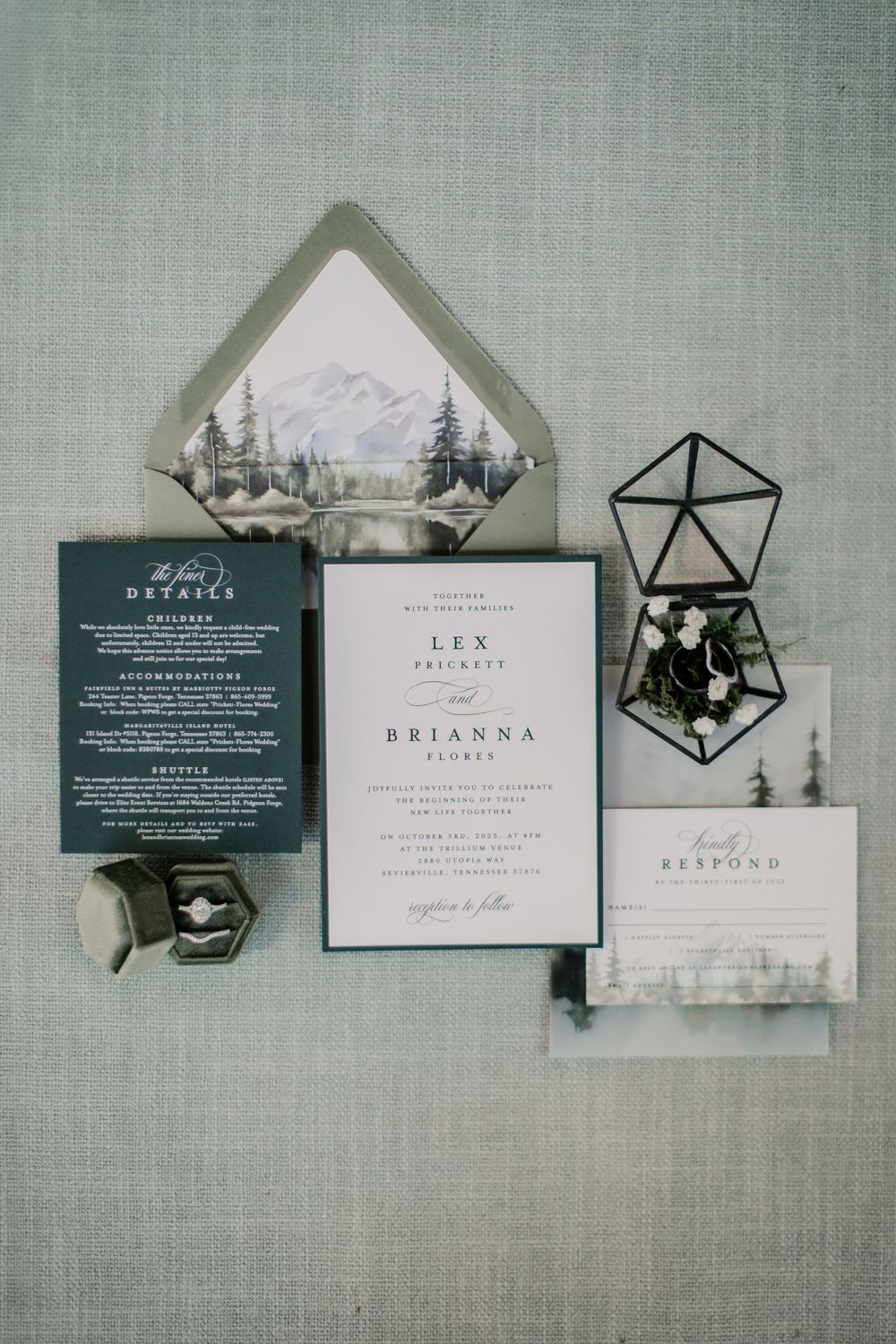 Elegant wedding invitation suite with mountain landscape envelope liner, dark green details, and geometric terrarium accent.