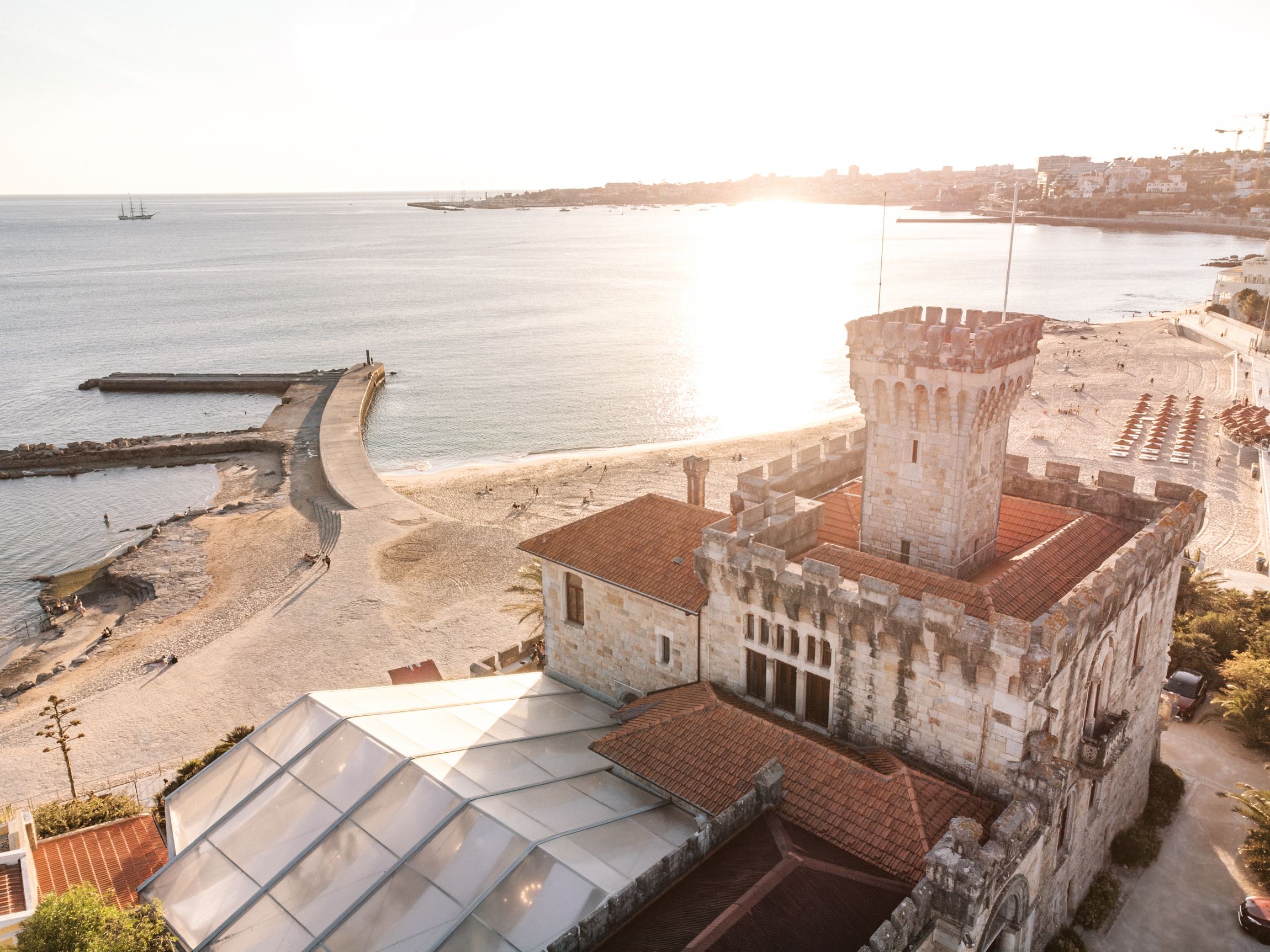 Drone view of coastal wedding venue in Cascais with ocean and historic architecture