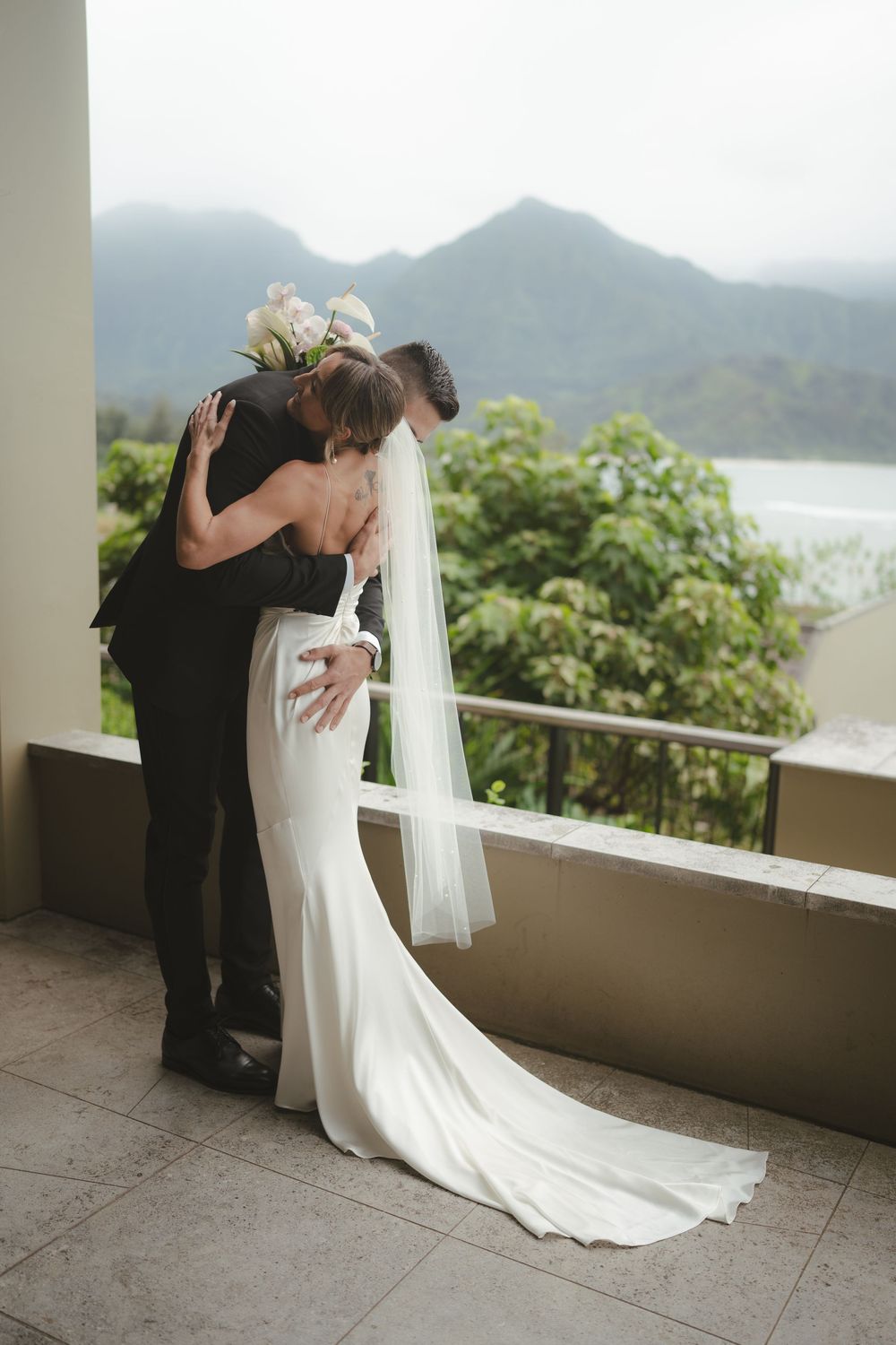Bride and Groom hugging at 1 Hotel Hanalei Bay