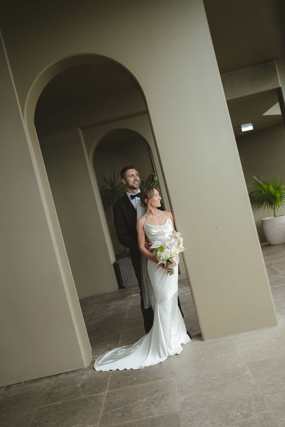 Bride and Groom posing at 1 Hotel Hanalei Bay