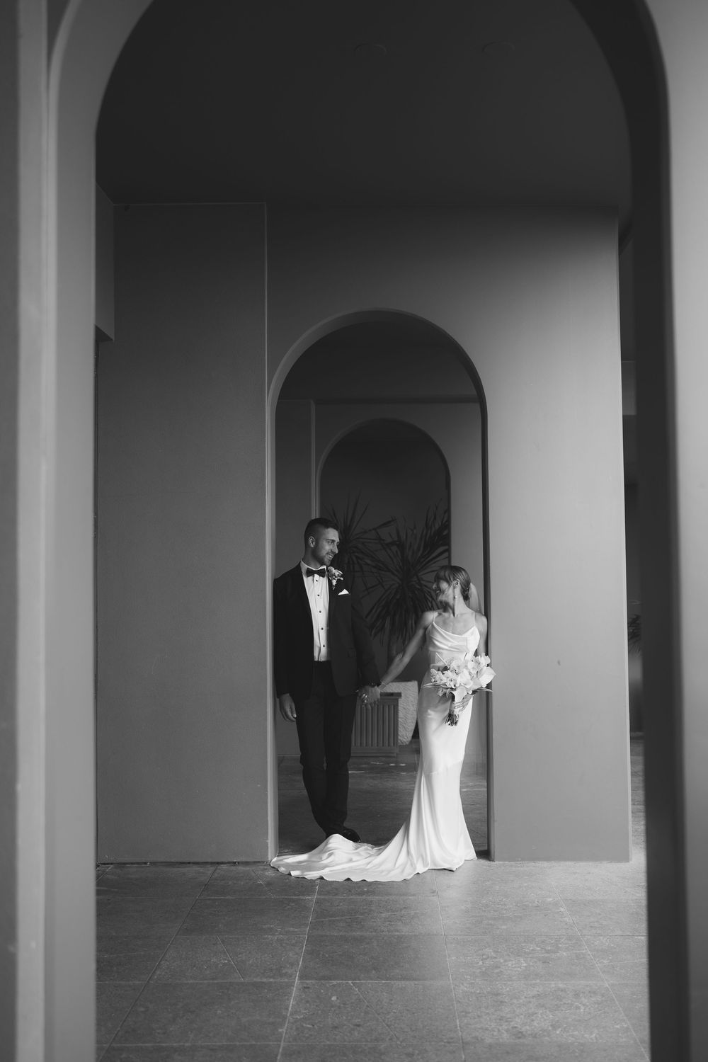 Bride and Groom posing at 1 Hotel Hanalei Bay