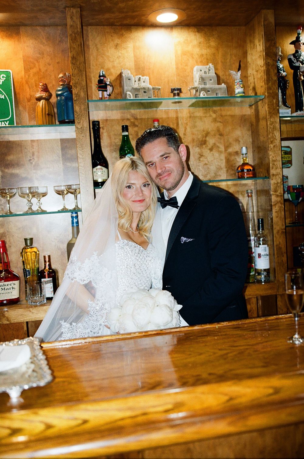 film wedding photographer at a wooden bar at historic estate by NC wedding photographer