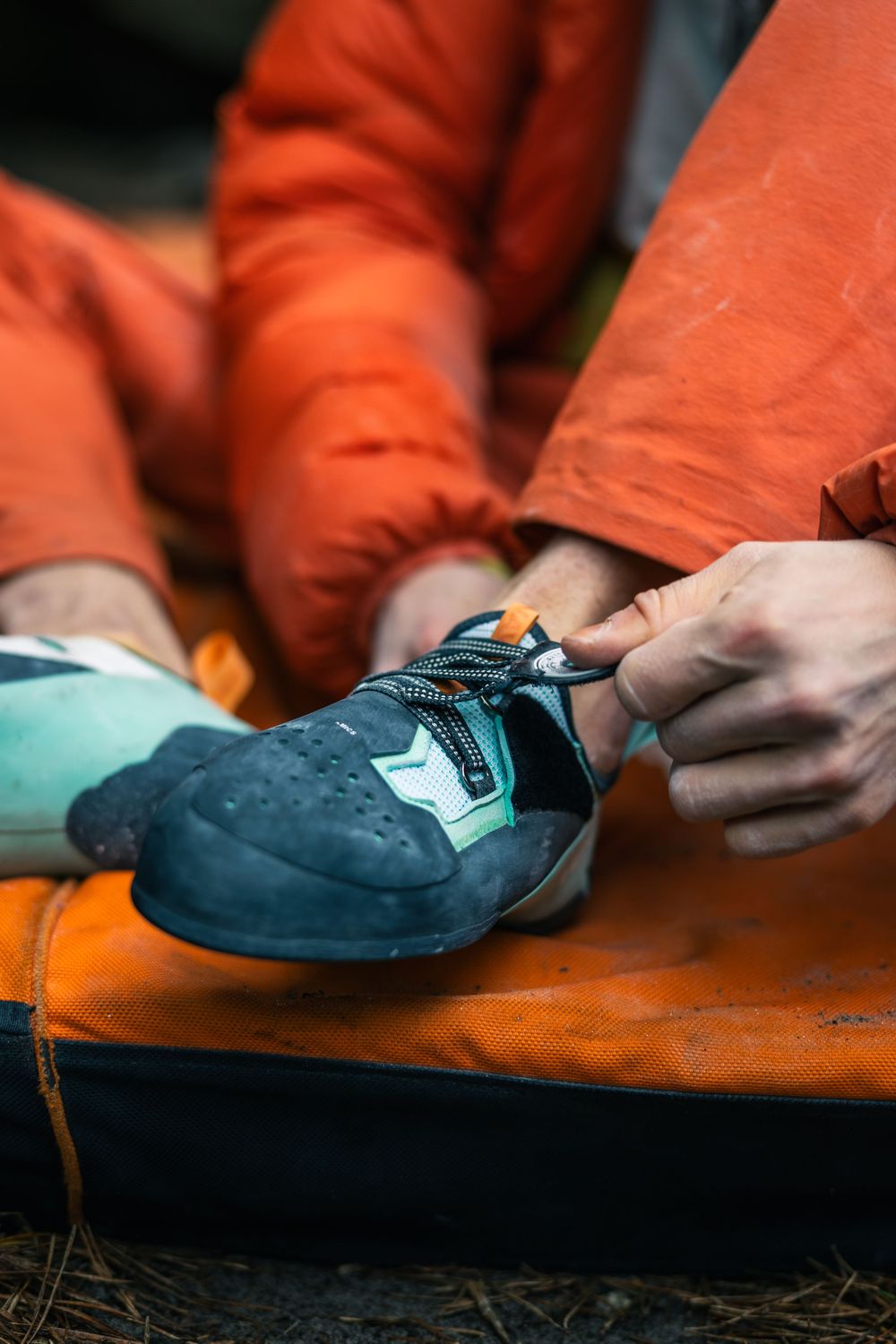 Alexander Megos putting on Tenaya Aruma climbing shoes before a bouldering session in Fontainebleau, France. Photo by Jan Virt.