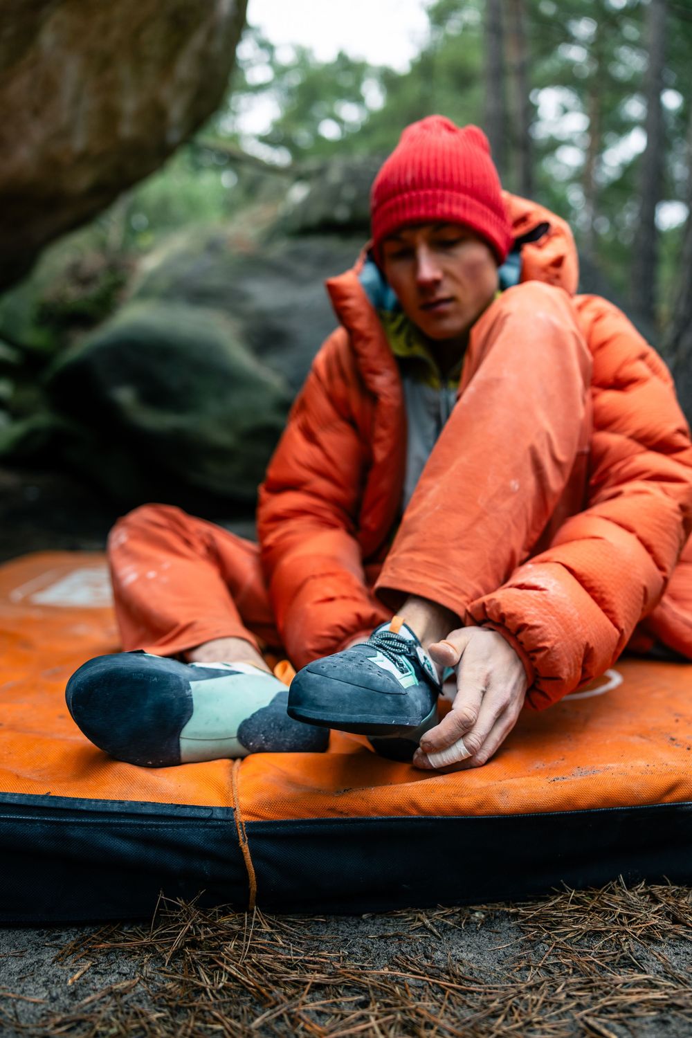 Alexander Megos resting between attempts during the Tenaya Aruma campaign shoot in Fontainebleau forest, France. Photo by Jan Virt.