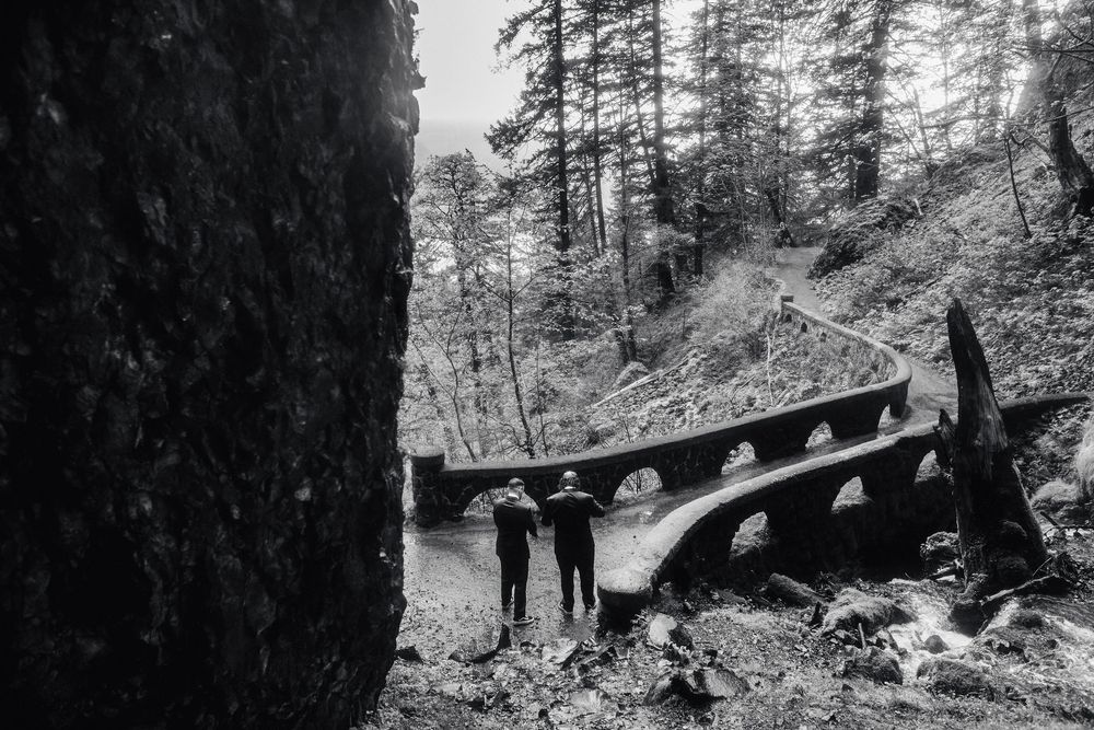 Couple about to cross the bridge after an elopement at Wahkeena Falls